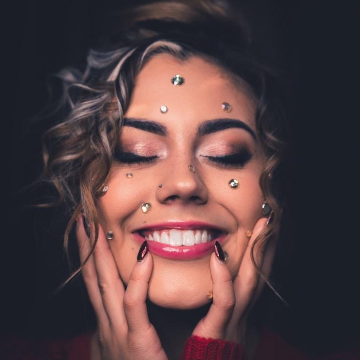 Kaveri Mehta, Lead Design Curator at HarvestStudioX, reviewing corporate floral arrangements